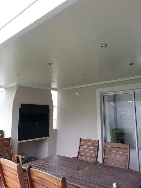 Modern aluminium ceiling installed over a patio