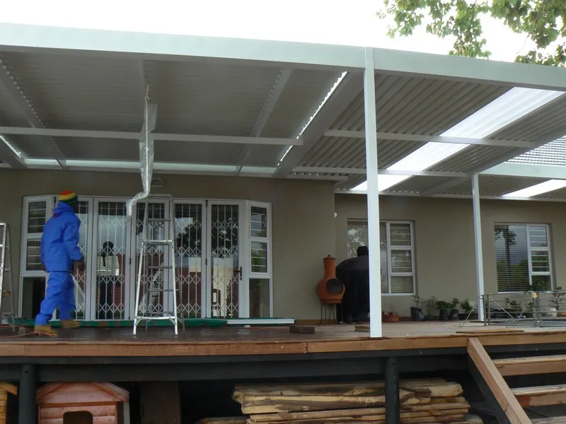 Combination canvas and aluminium awning shading a patio
