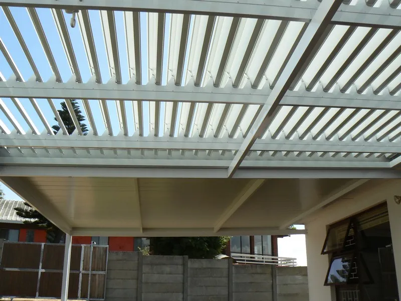 Retractable awning and drop blind on a beachfront home