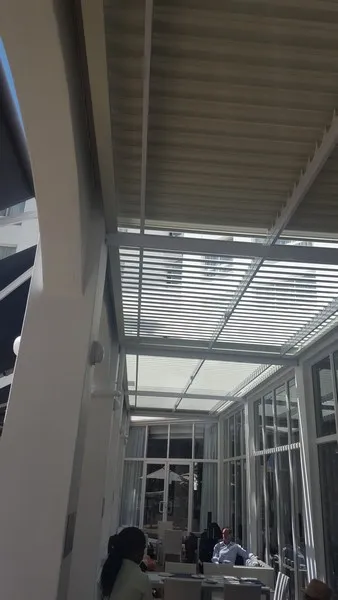 Wide awning shading the terrace of a restaurant