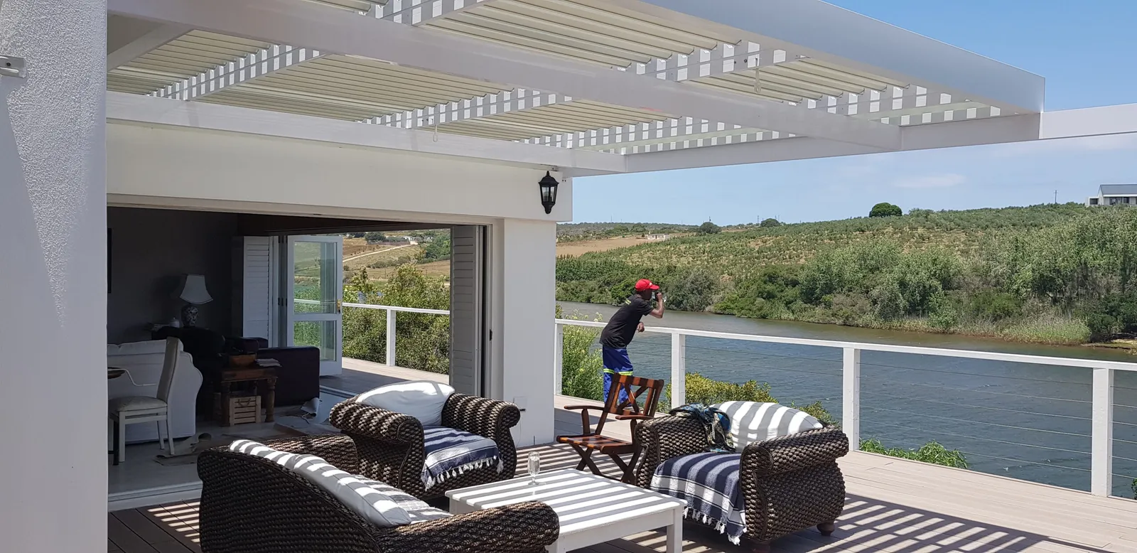 Louvre awning over a riverside deck on the Garden Route