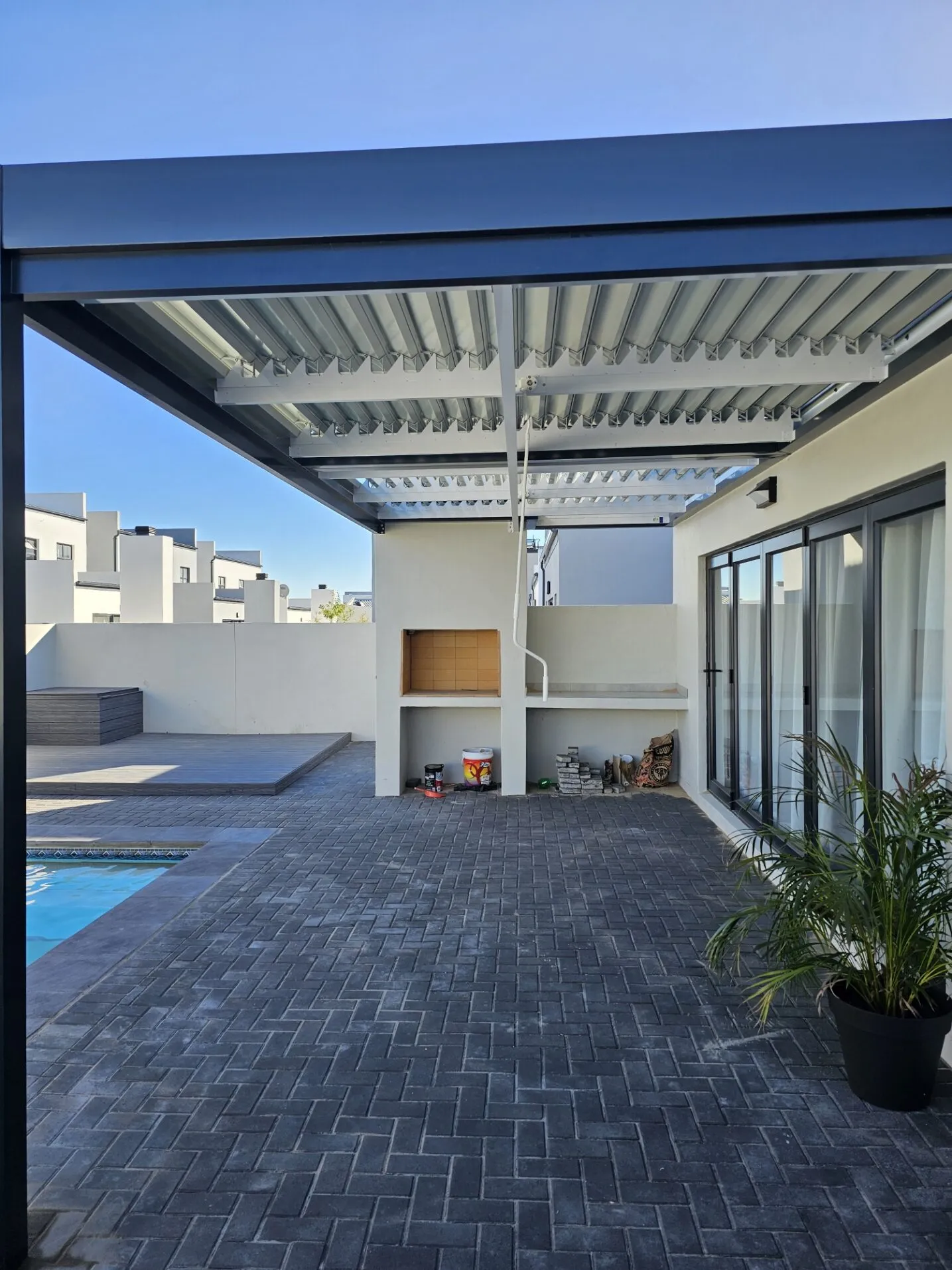 Newly installed charcoal patio cover on a family home