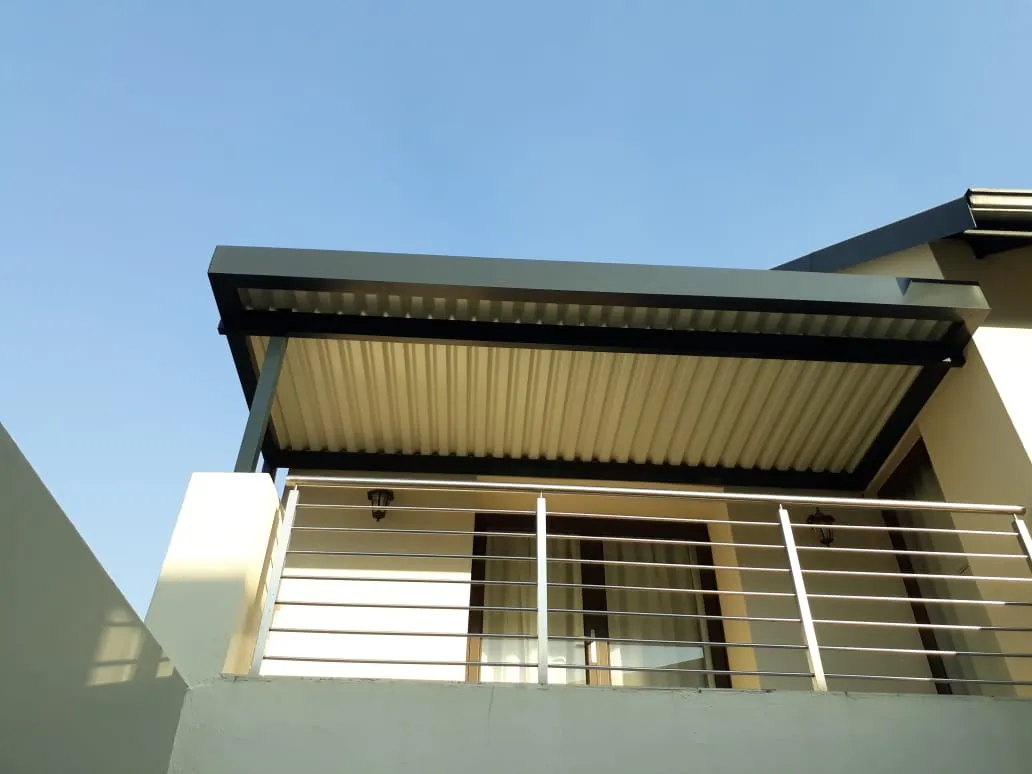 Baked-aluminium louvre awning on a coastal deck