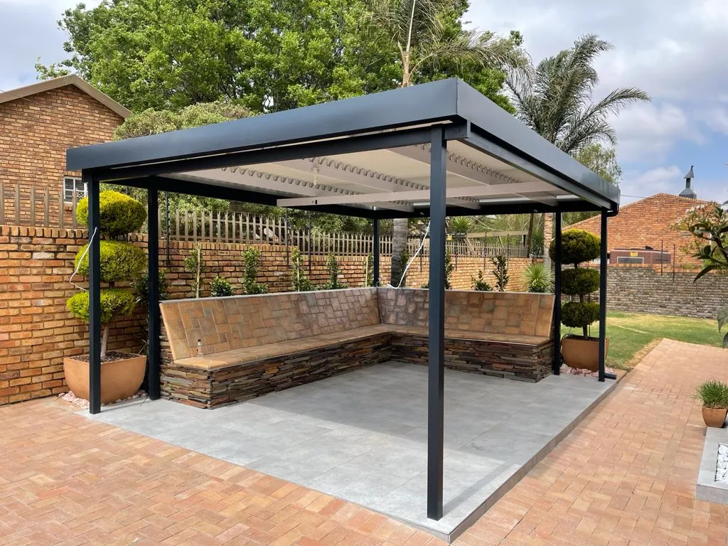 Freestanding aluminium louvre pavilion in a garden